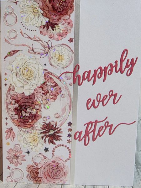 Slimline handmade wedding card featuring layered watercolour burgundy and blush roses, white blooms, holographic pearl bubble details and a die-cut happily ever after sentiment in deep rose — Handpress Cards