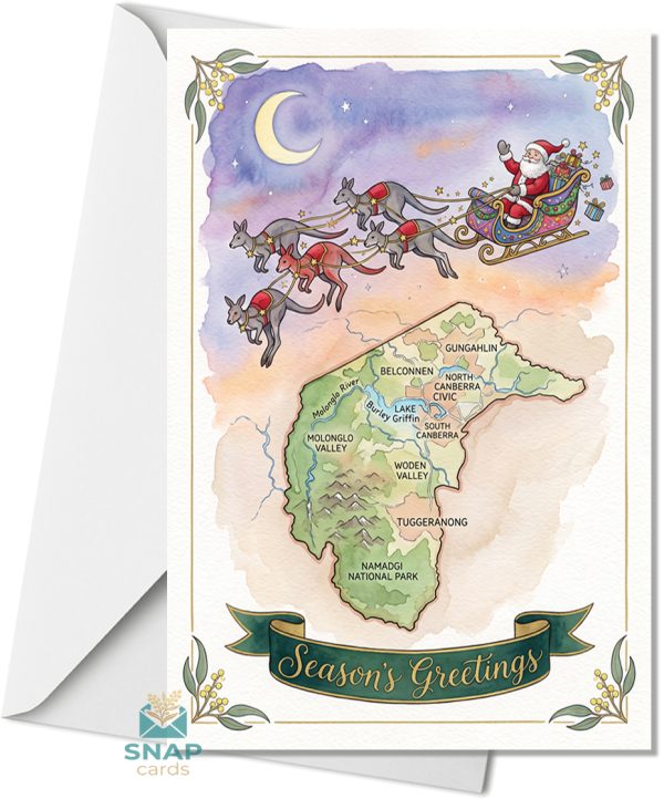 Christmas card showing Santa's sleigh pulled by kangaroos flying under a crescent moon over a labelled watercolour map of Canberra and the Australian Capital Territory, with "Season's Greetings" on a ribbon banner